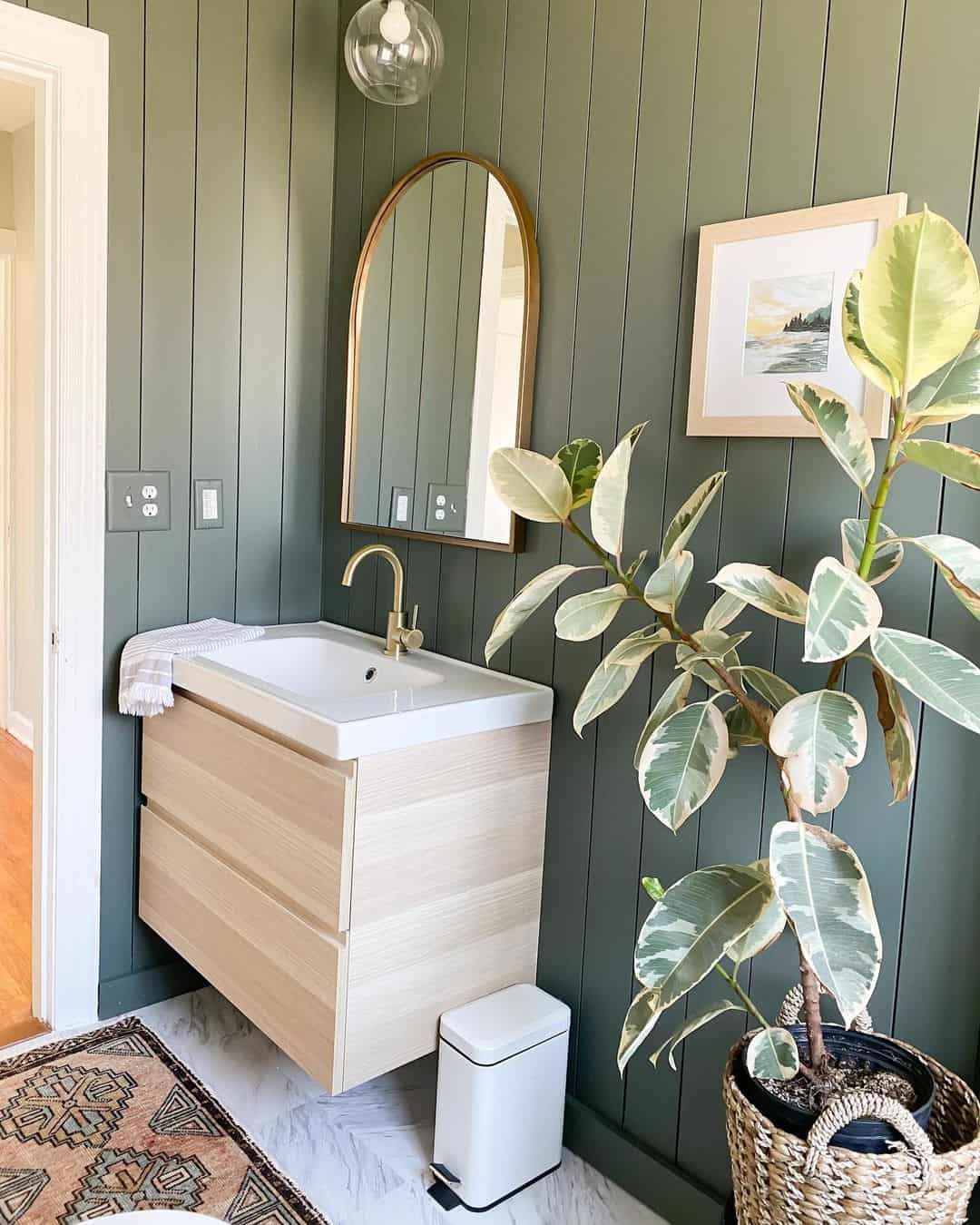 Pale Wood Vanity Contrasts Dark Green Walls
