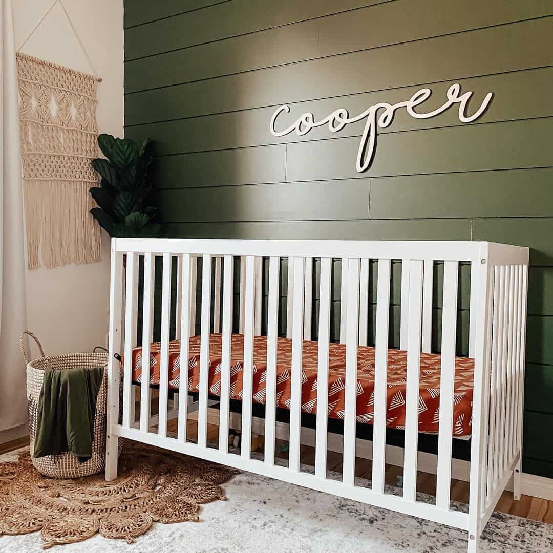 Green Shiplap Walls Accentuated by a Custom Name Display