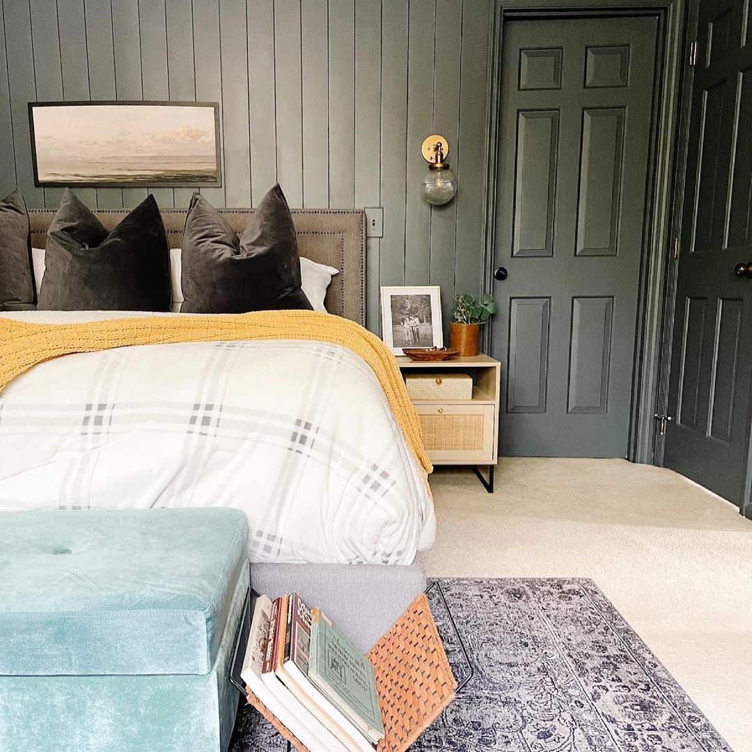 Deep Green Vertical Paneling Adds Subtle Dimension Behind the Bed