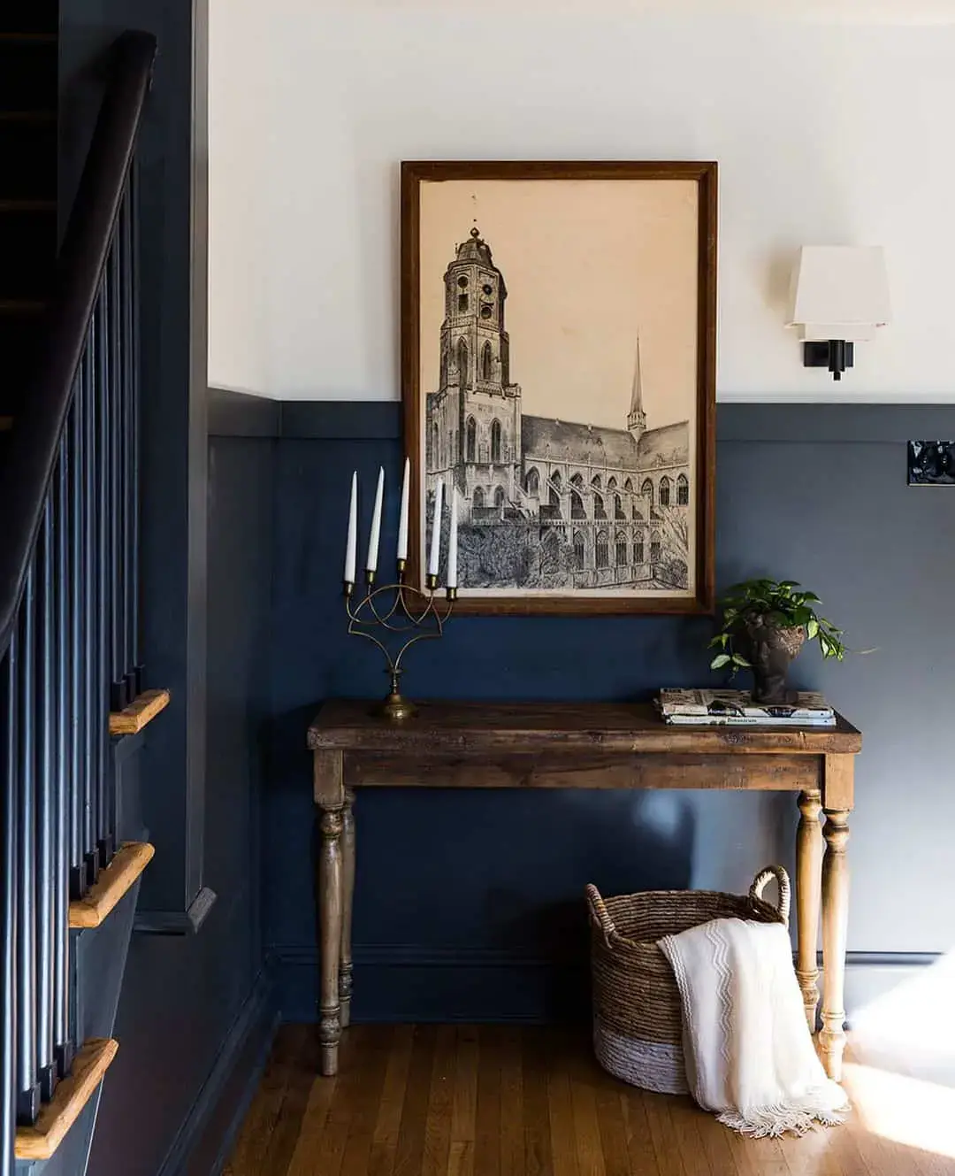 Framed Architectural Sketch Anchors a Dark Entryway