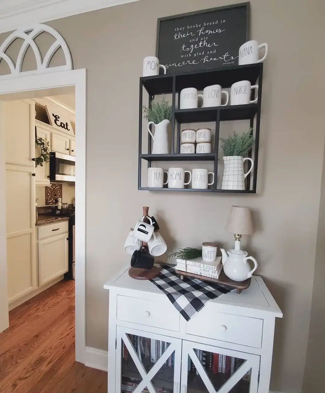 Black Grid Shelf Organizes Mugs and Kitchen Herbs