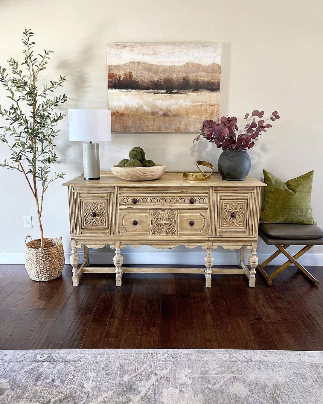 Textured Wood Sideboard Displays Layered Natural Decor