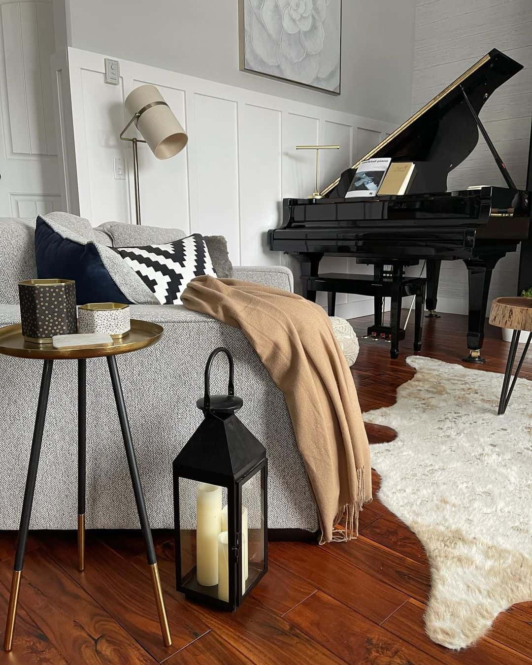 Black Lantern Adds Cozy Ambiance Next to Sofa