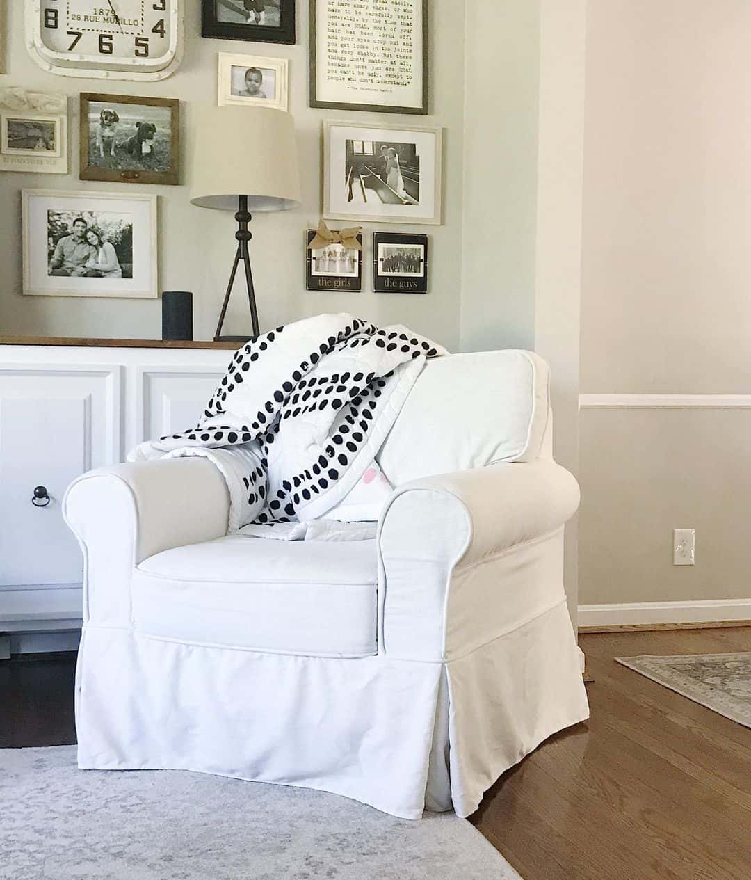 Gallery Wall Above Cabinet Creates Personal Focal Point