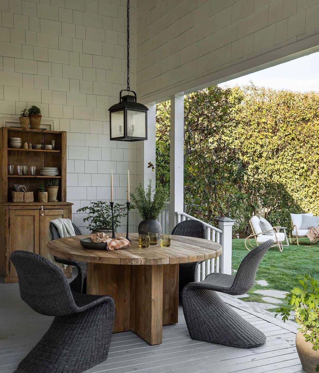 Candlesticks and Greenery Create a Moody Centerpiece