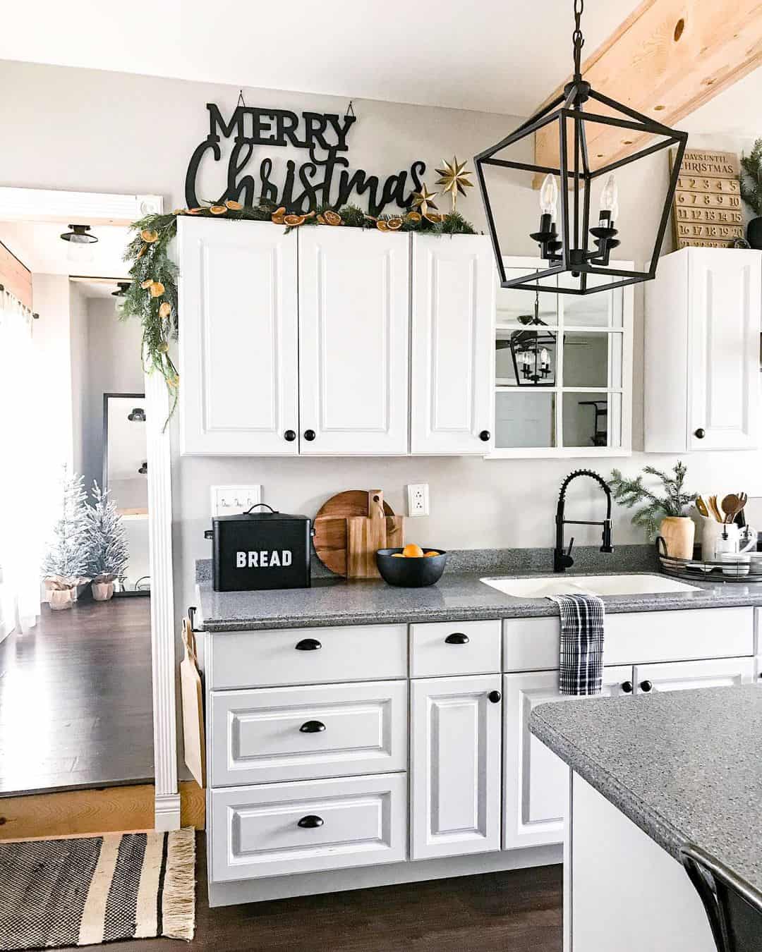 Frame Cabinet Tops with a 'Merry Christmas' Sign and Garland