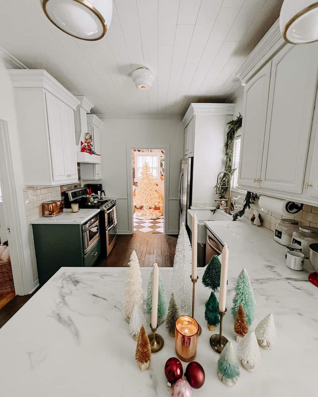 Bottle Brush Trees and Candles Create a Festive Kitchen Vignette