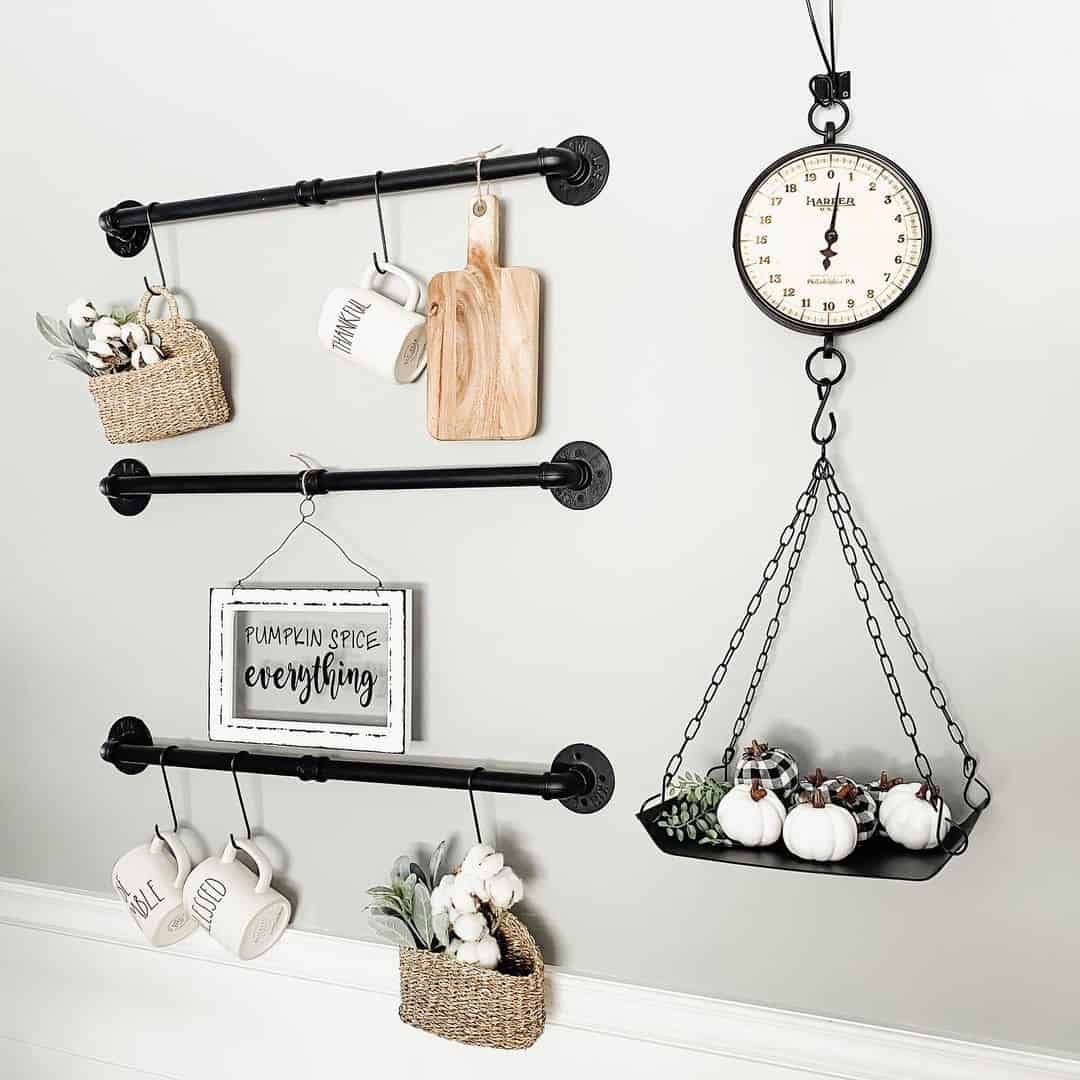 Black Pipe Rails Hold Seasonal Decor and Kitchen Essentials