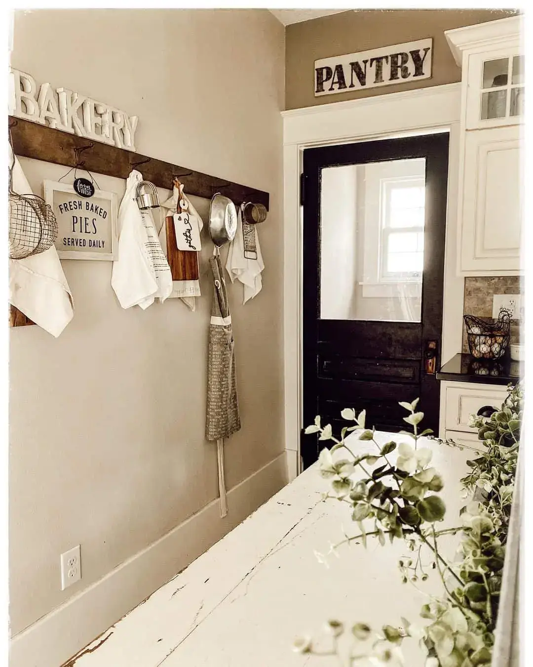 Wooden Rack Displays Kitchen Linens and Utensils