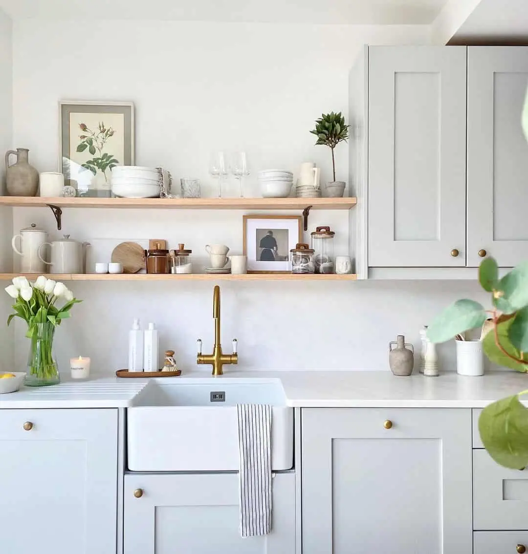 Framed Portrait Adds Personal Touch Above Kitchen Shelves