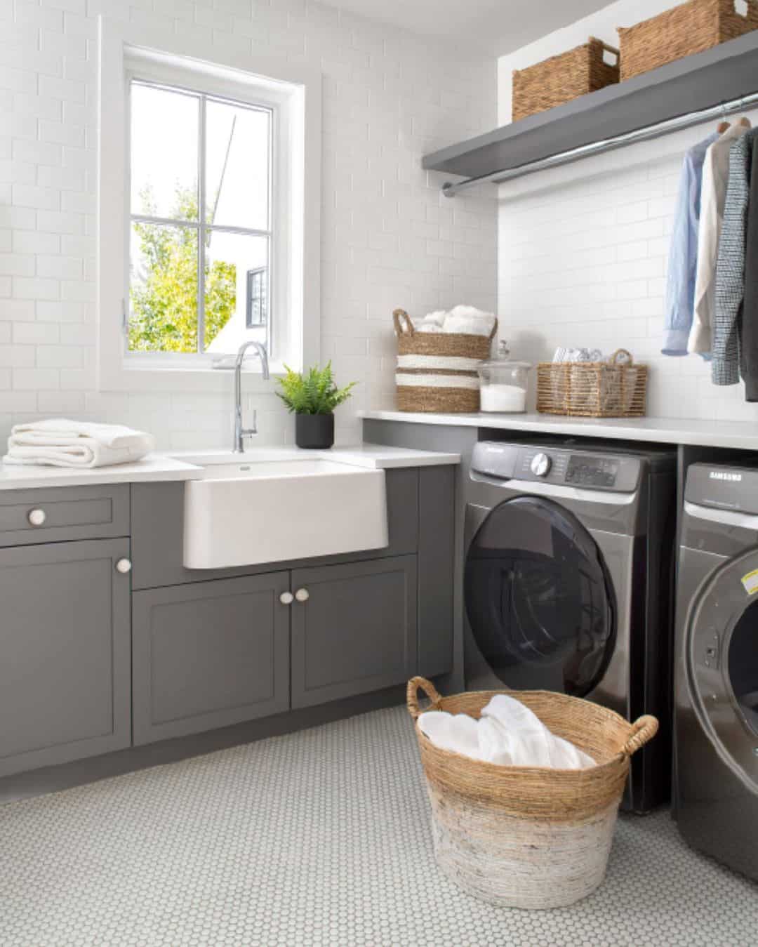 Gray Cabinetry With White Farmhouse Sink Offers A Clean Work Zone