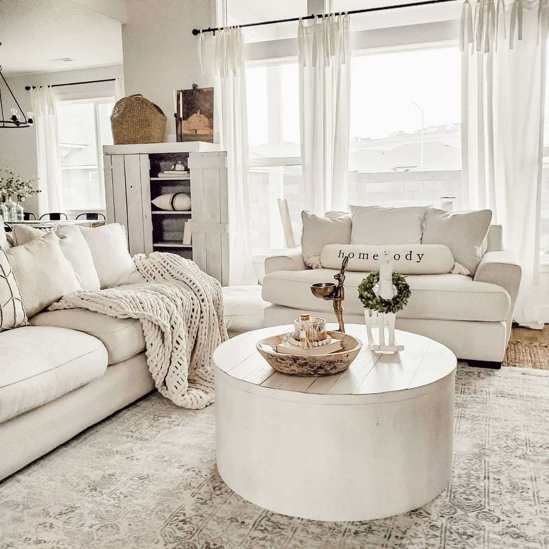 Round White Coffee Table With Planked Top Holds Natural Decor