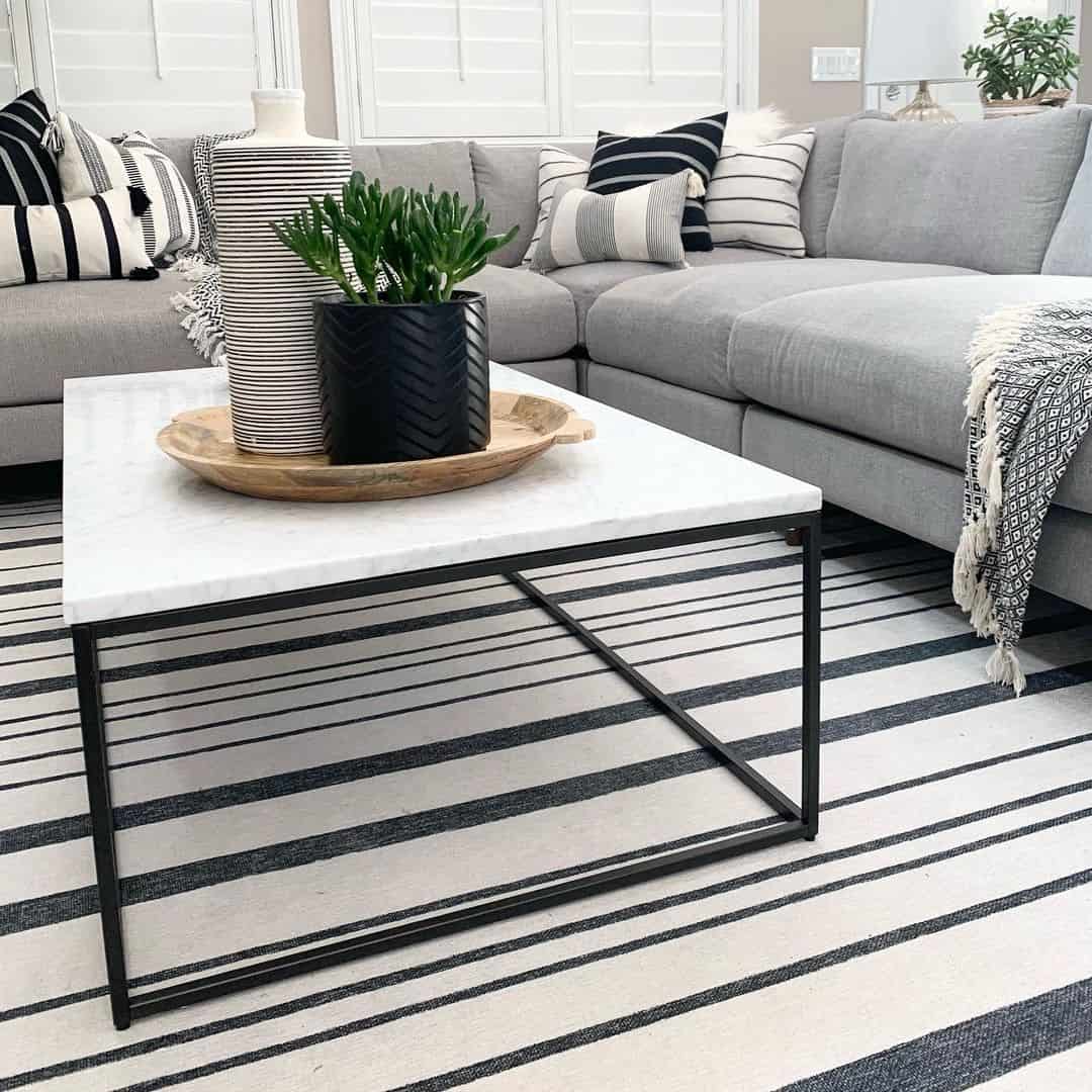 Anchor Your Rug With a Marble-Top Coffee Table and Black Accents