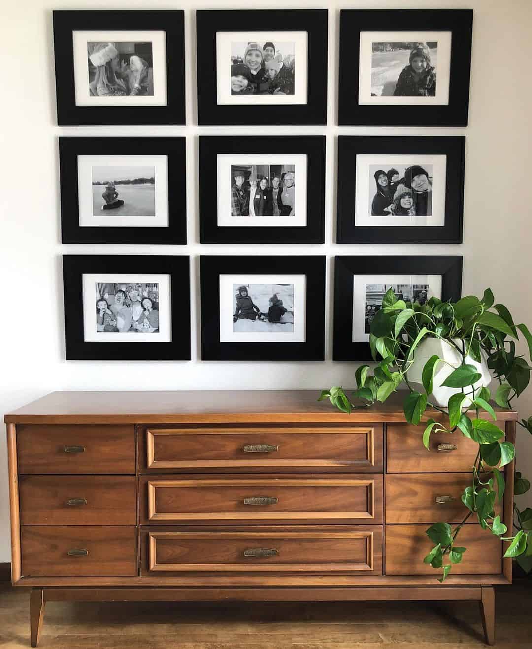 Unified Display Above a Dresser with Nine Black Frames