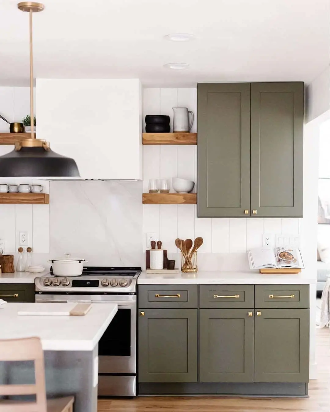 Update sage green cabinets with brass square knobs and pulls