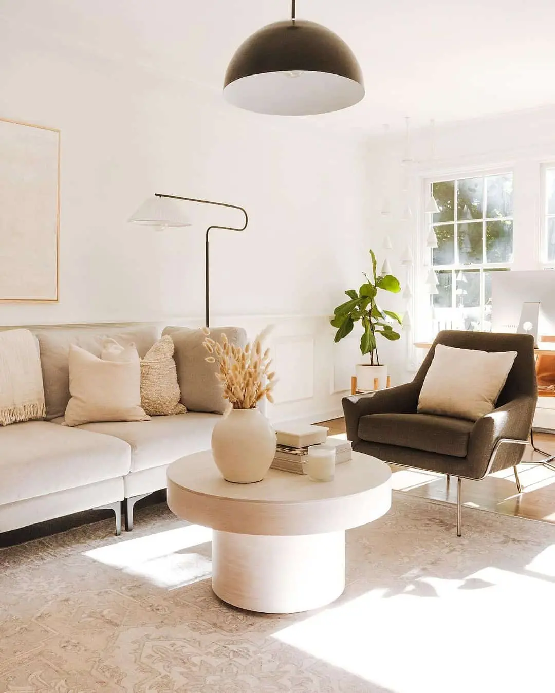 Textured Vase and Books Create a Layered Coffee Table Vignette