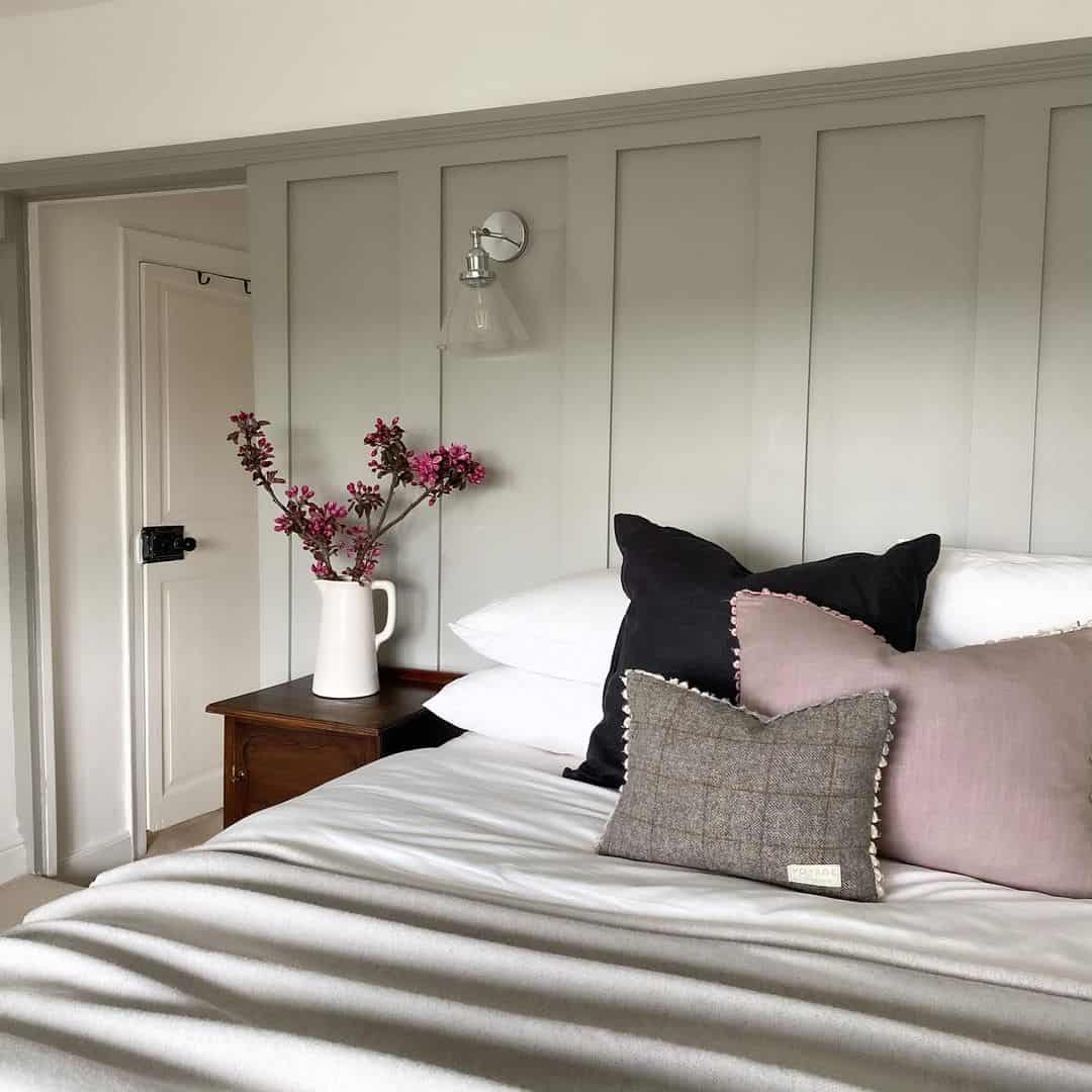 Paneled Wainscoting Mounts a Tapered Glass Sconce