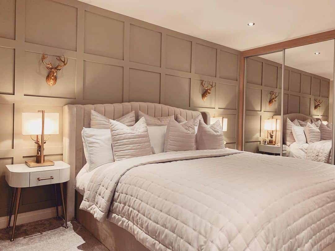 Paneled Walls Frame Golden Deer Head Accents