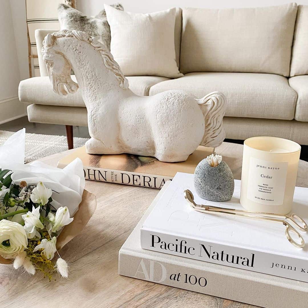 Sculptural White Horse Adds Whimsical Charm to Book Stack