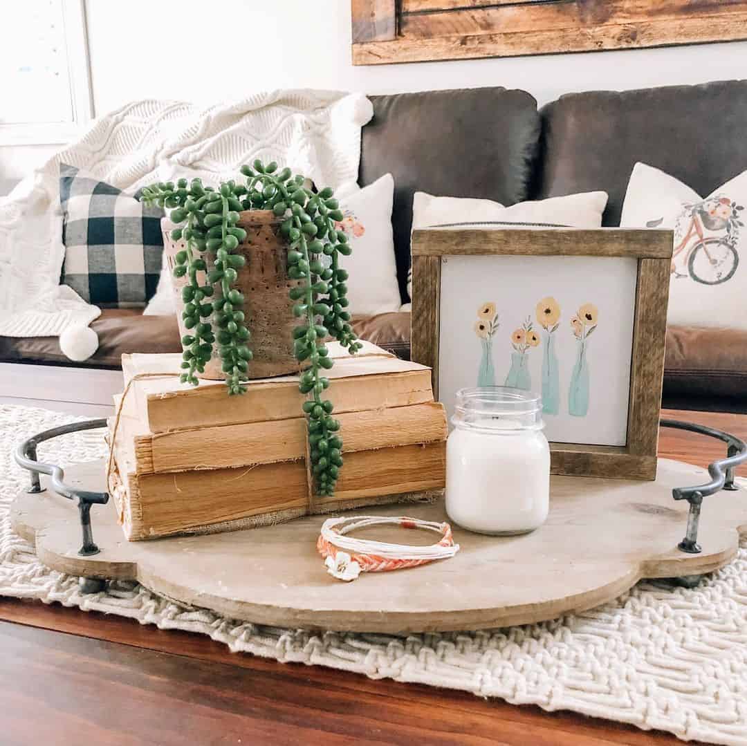 Stack Old Books With a Trailing Plant and Framed Art
