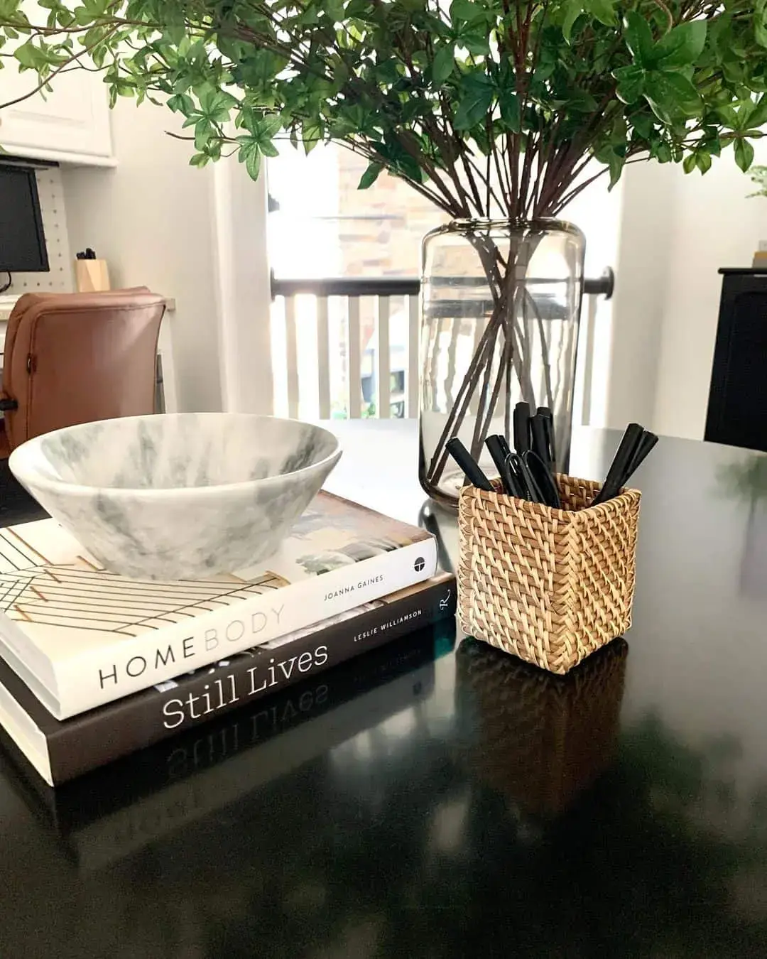 Stack Books Topped With a Marble Bowl for Texture
