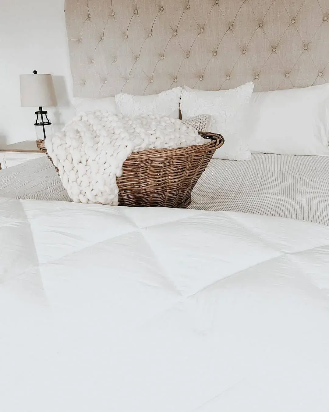 Woven Basket Adds Cozy Texture to White Bedding
