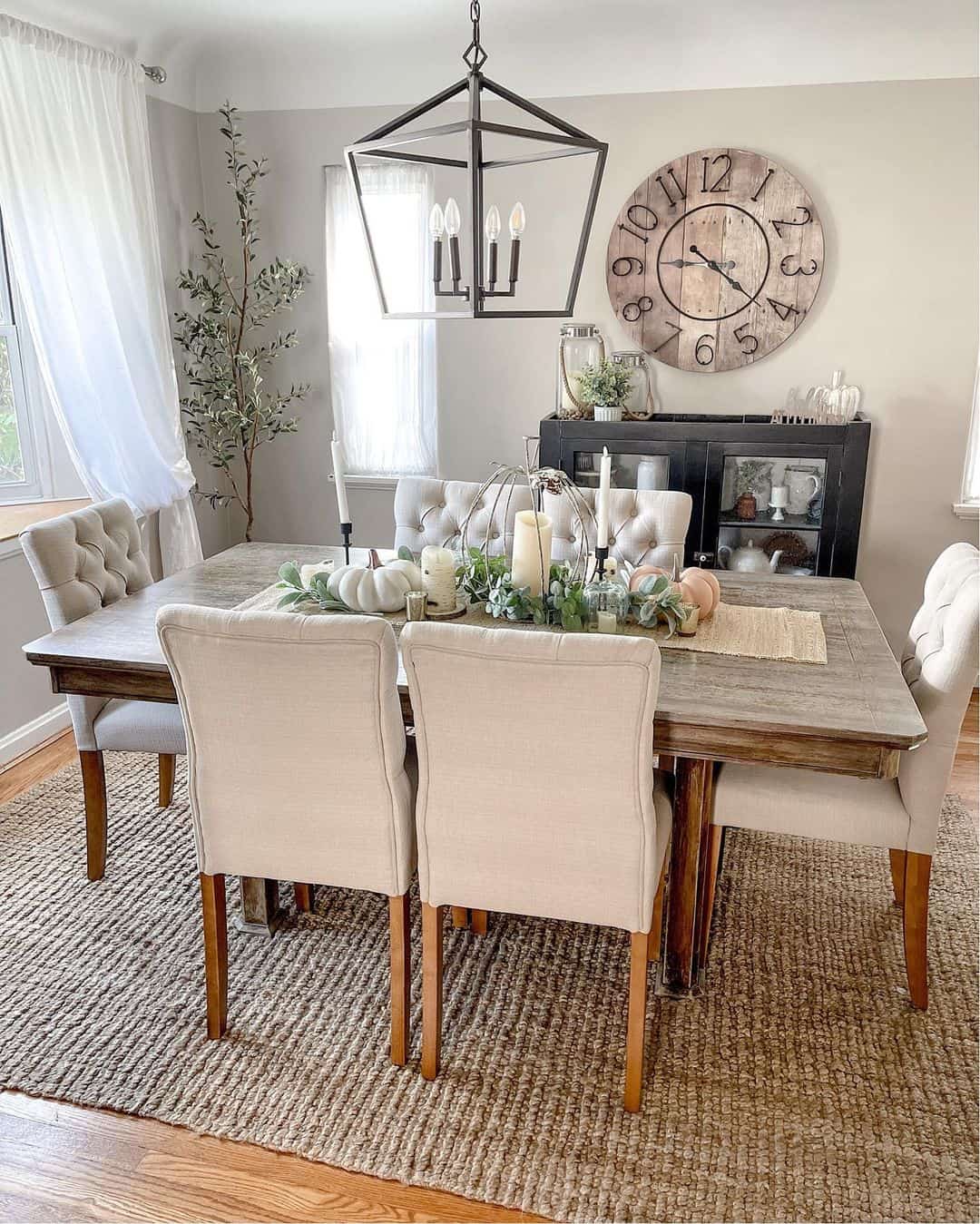 Jute Rug Anchors a Rustic Dining Set with Tufted Chairs