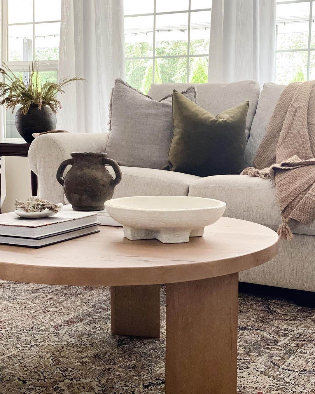 Light Wood Table With Sculptural White Bowl
