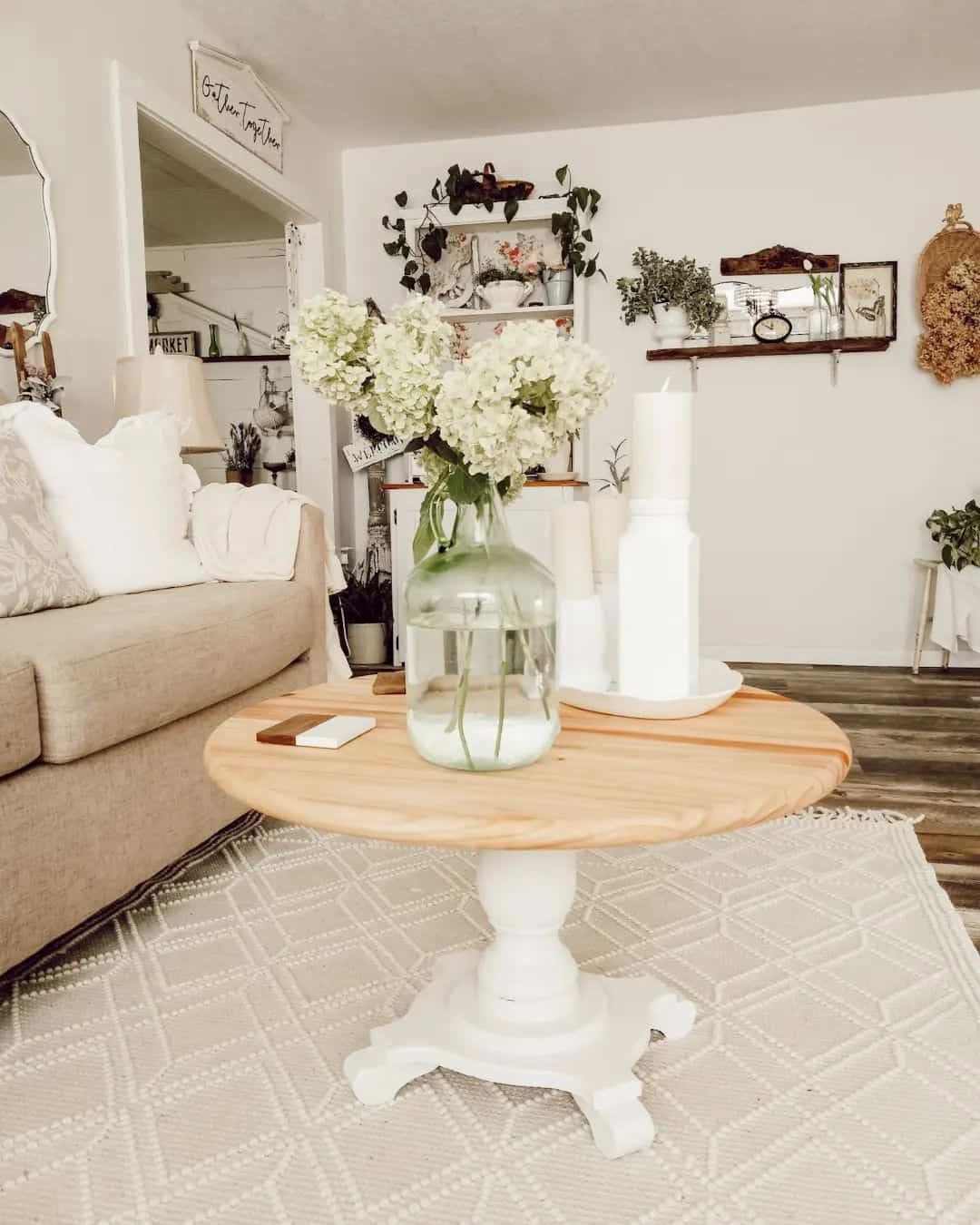 Pedestal Table With Simple White Candle Grouping