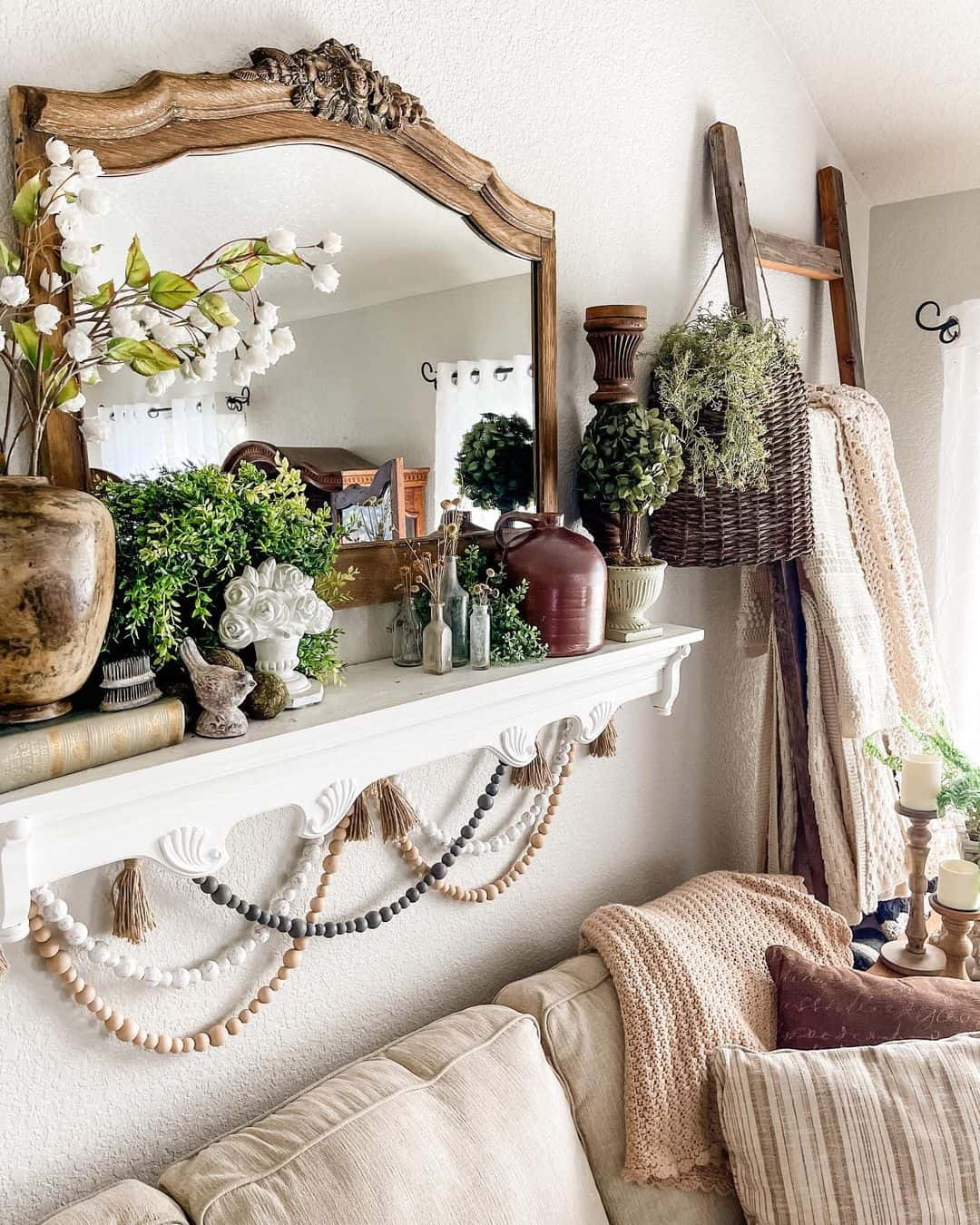 Ornate Wood Mirror Frames a Cozy Living Room Vignette