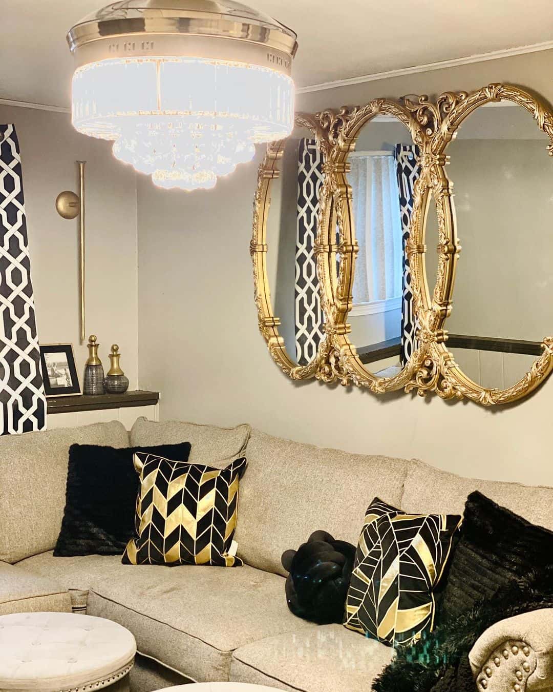 Triple Oval Mirrors Add Opulence Above a Sectional Sofa