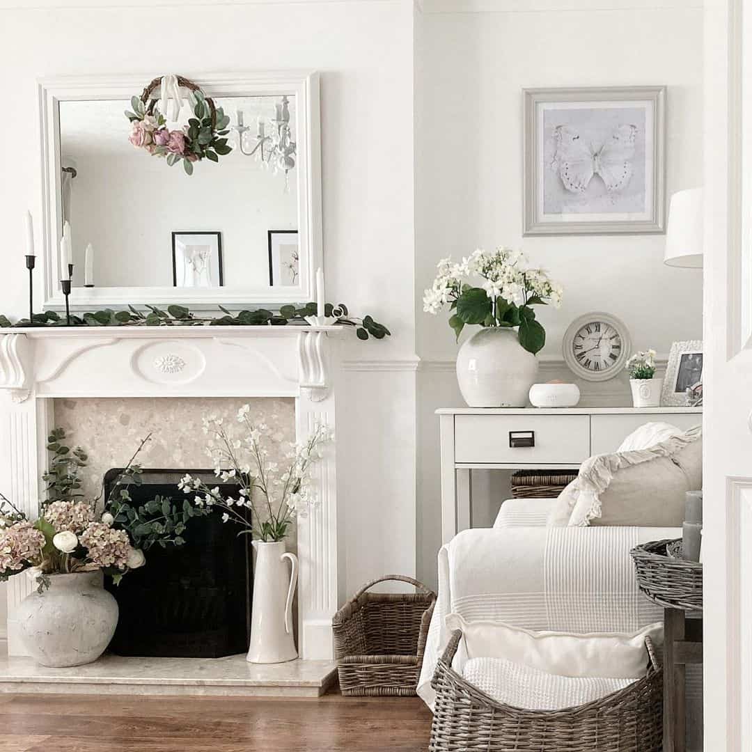 White Mirror Frames a Floral Wreath Above a Fireplace