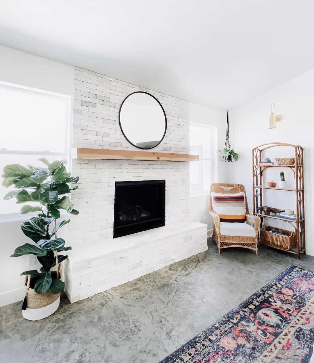 Thin Black Mirror Frames a White Brick Fireplace