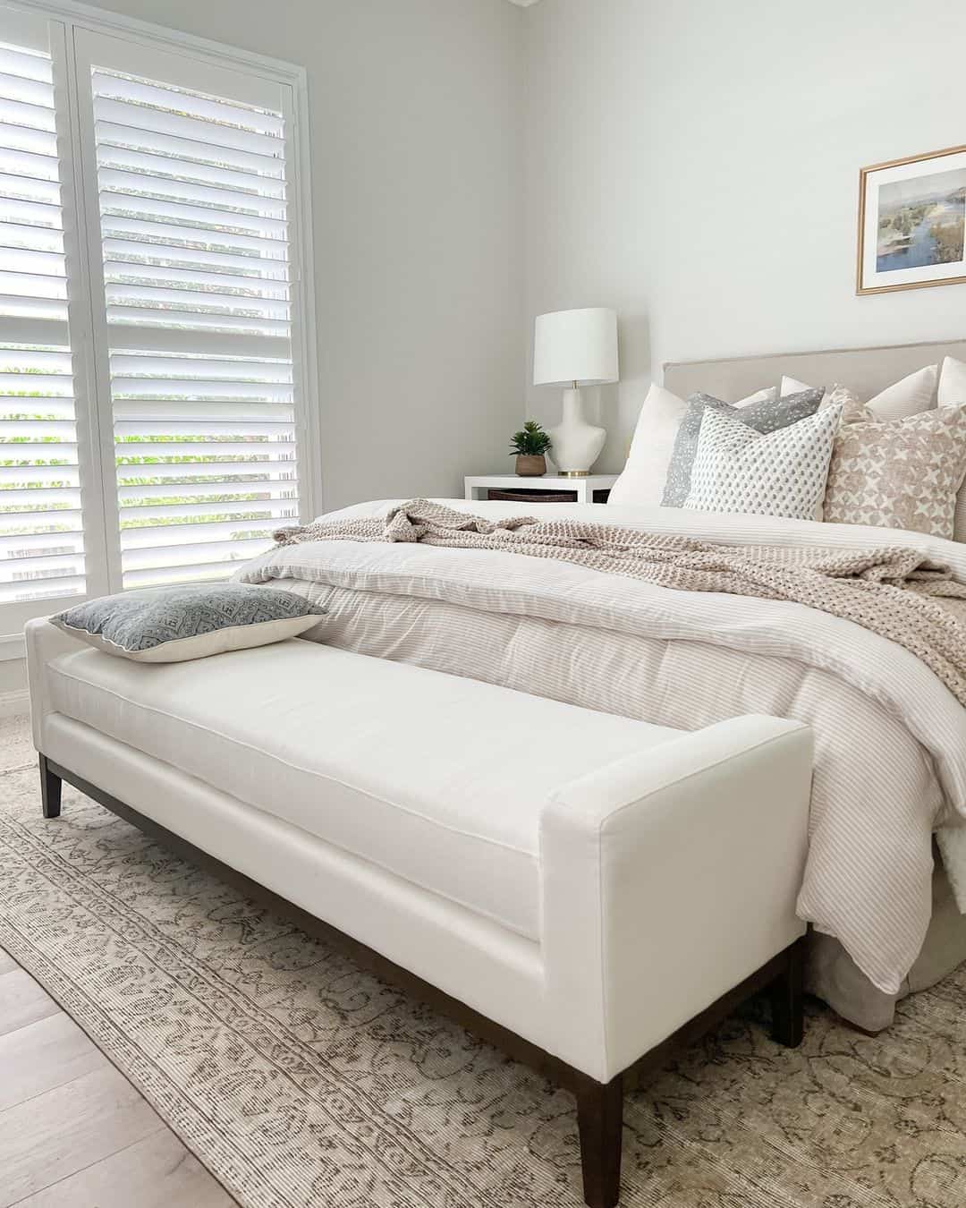 White Upholstered Bench Adds Serene Seating at Foot of Bed
