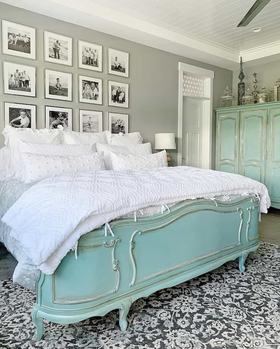 Gallery Wall of Black and White Family Photos Above Bed