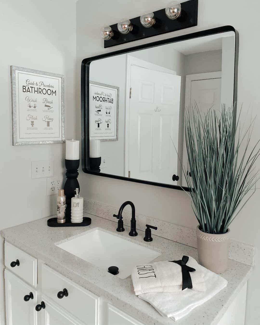 Black Framed Mirror Anchors a Modern Farmhouse Vanity