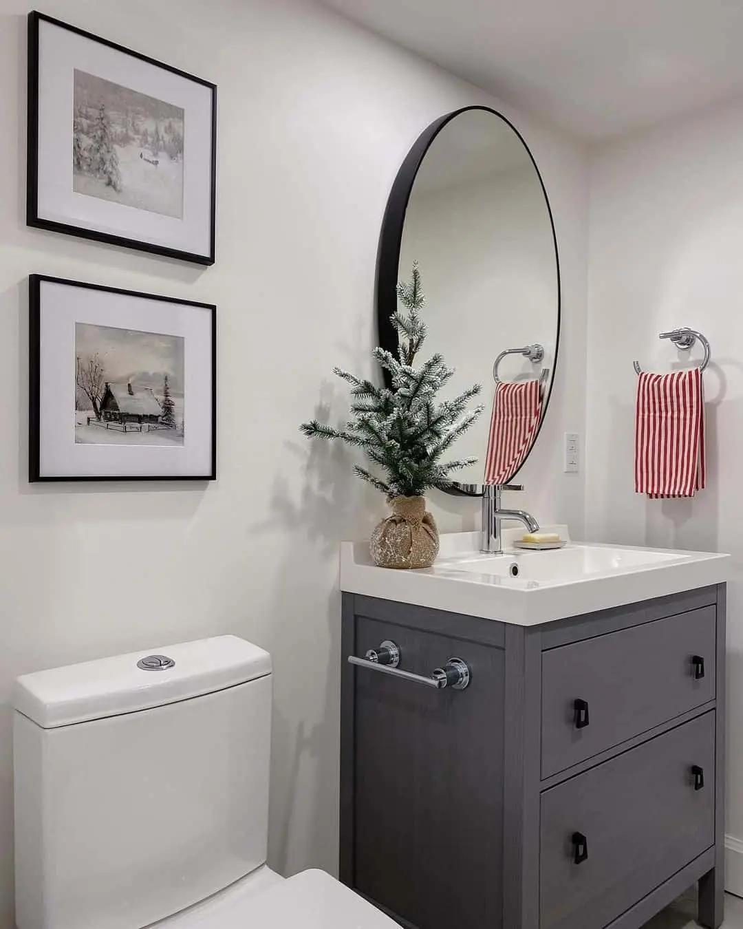 Stacked Winter Art Creates a Cozy Focal Point Above the Toilet