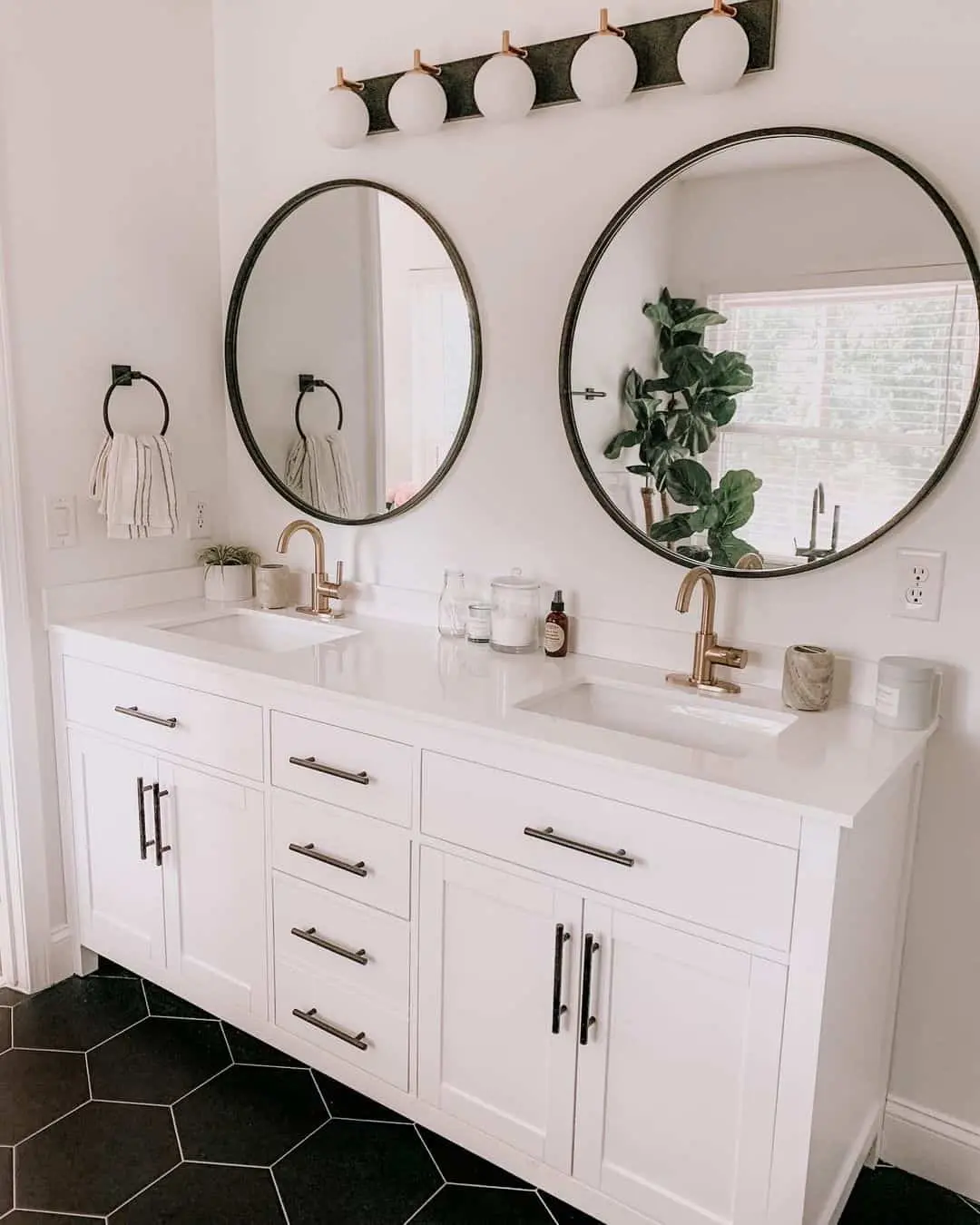Pair of Round Mirrors Create Symmetry Above a Double Vanity