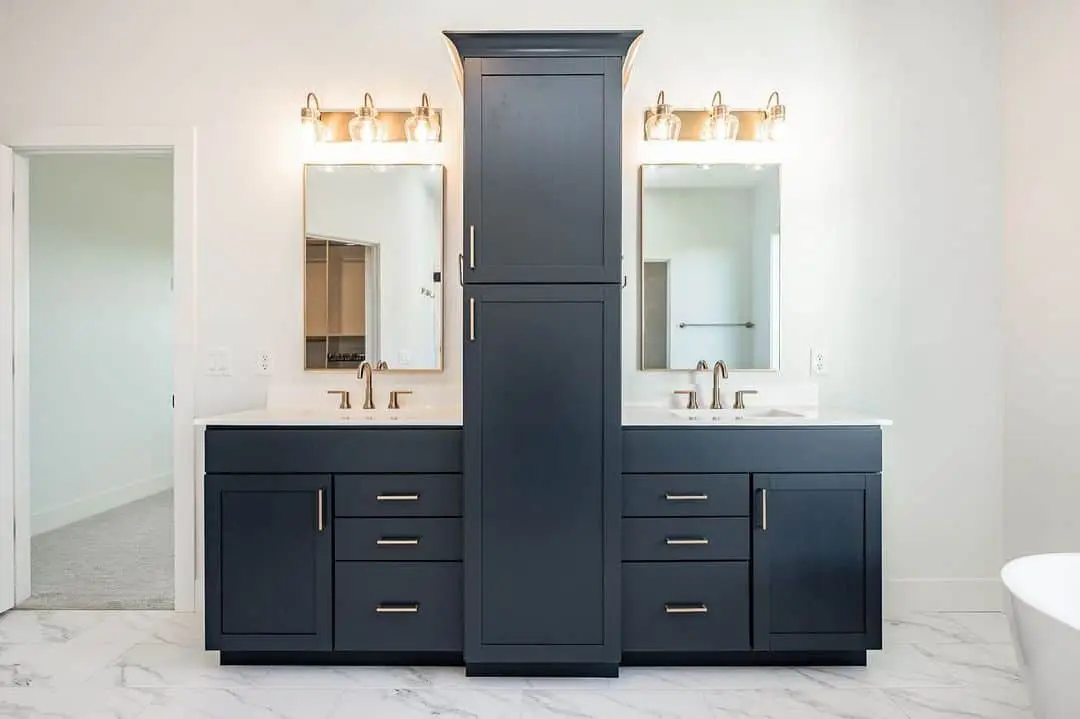 Tall, Slim Cabinet Divides Dual Vanities for a Striking Centerpiece