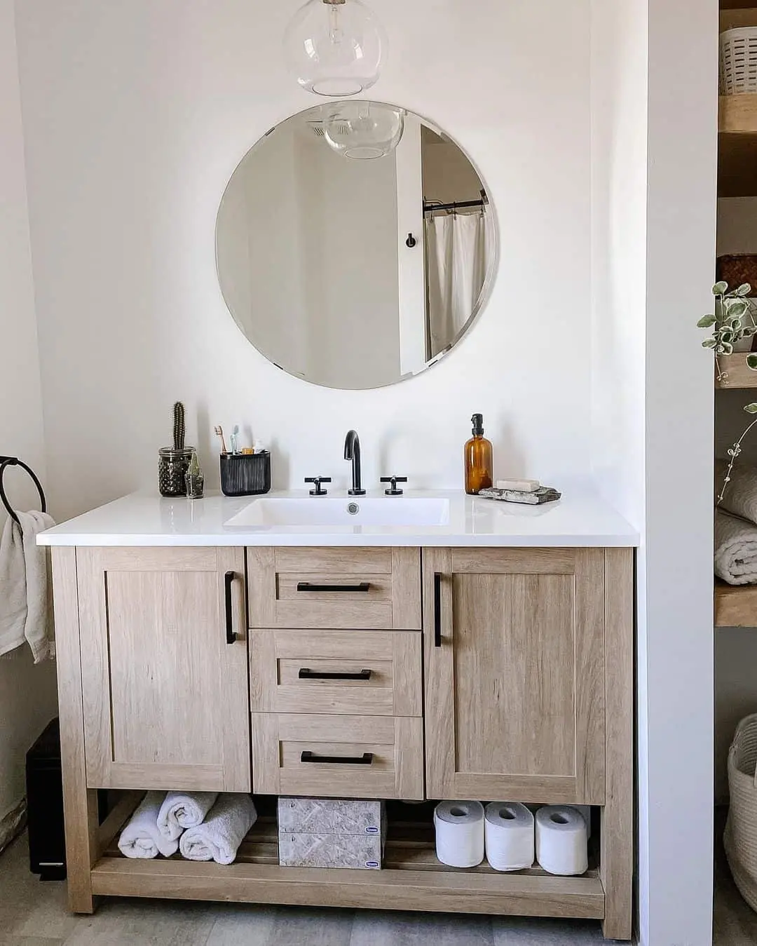 Light Wood Vanity With Open Shelving for Towels and Toilet Paper