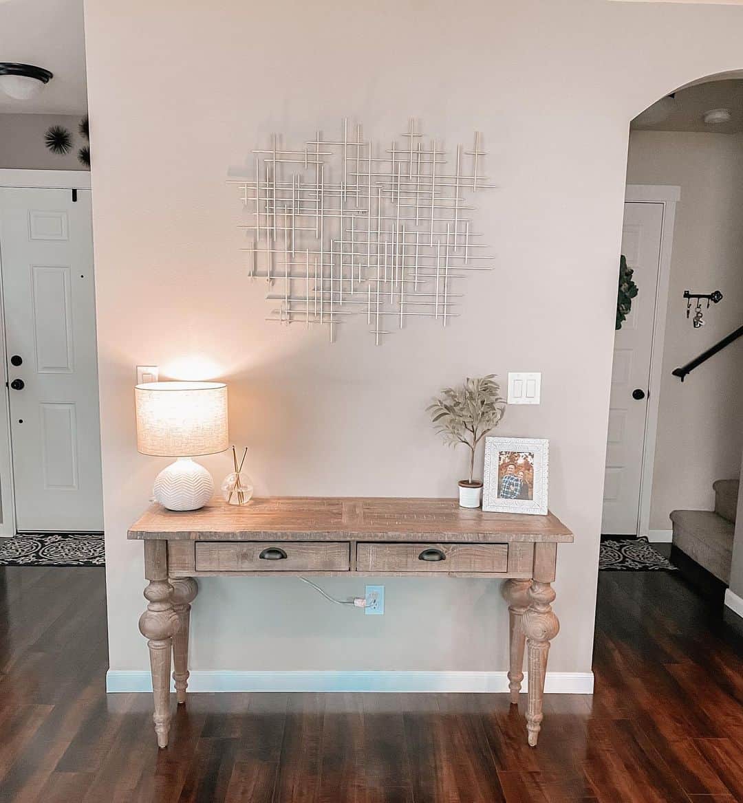 Geometric Metal Wall Art Adds Artistic Flair Above A Console Table