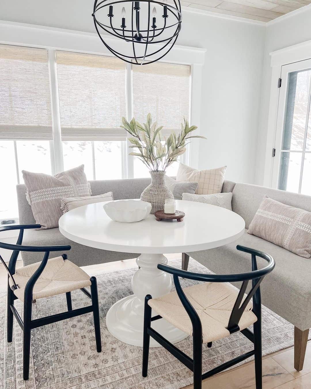 Opt for a White Pedestal Table with Black Wishbone Chairs