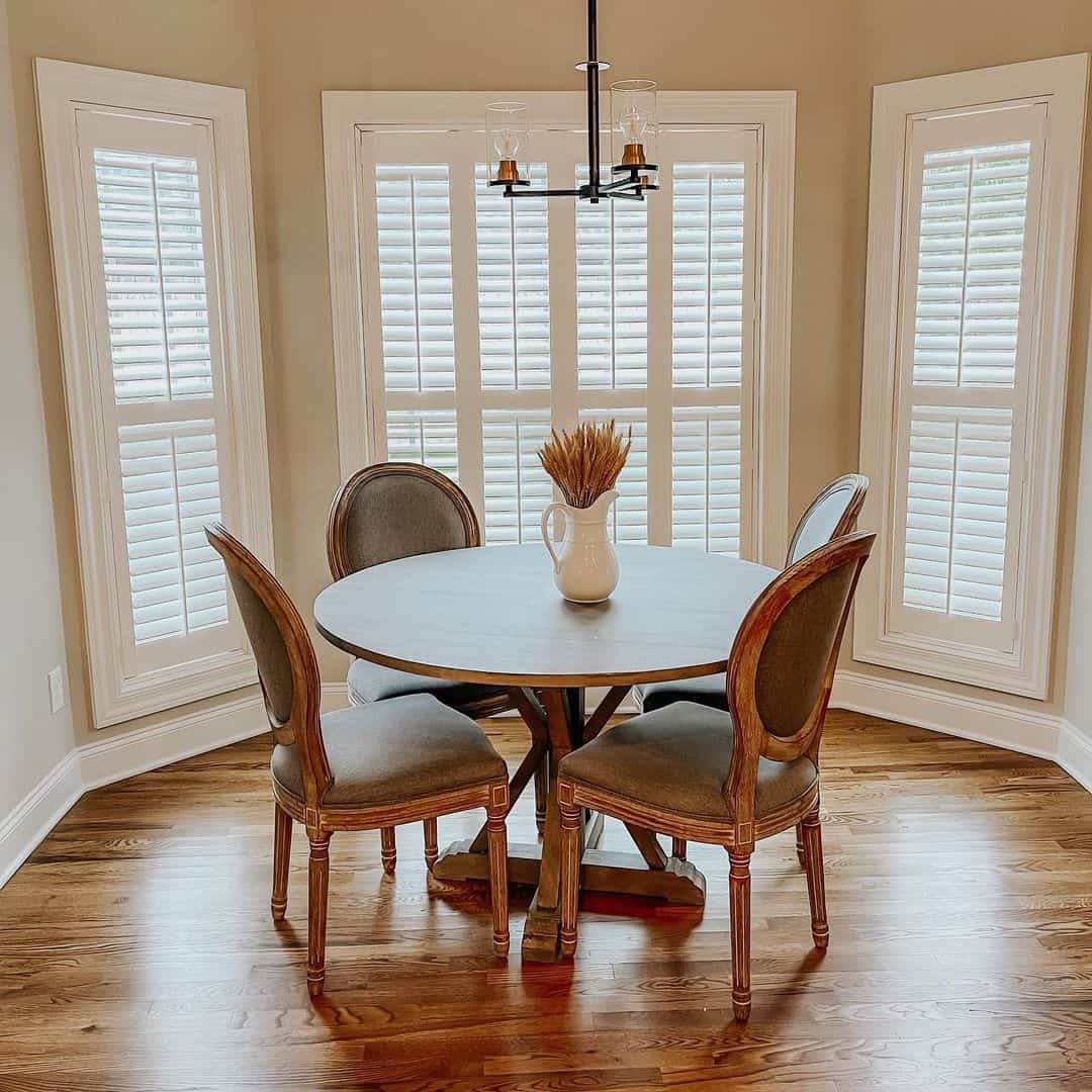Ground Your Dining Area with a Dark Pedestal Table