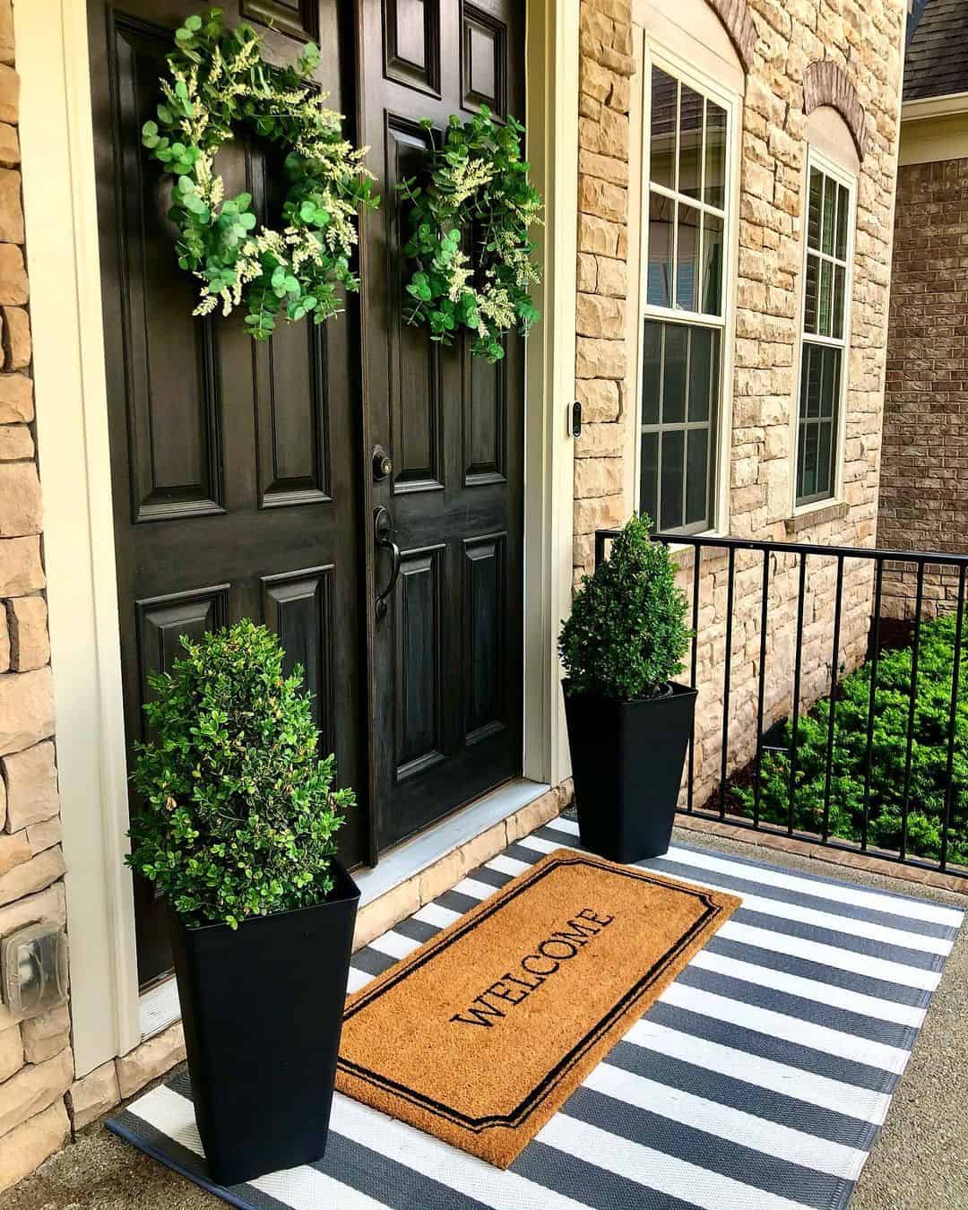 Symmetrical Wreaths on Double Doors Create a Welcoming Balance