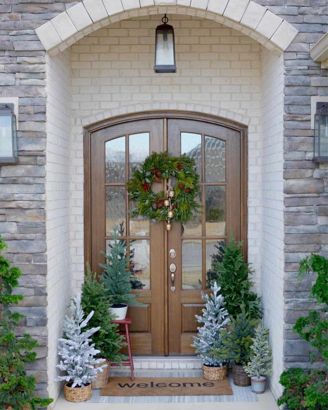 Flocked Miniature Trees Create a Winter Wonderland Entrance