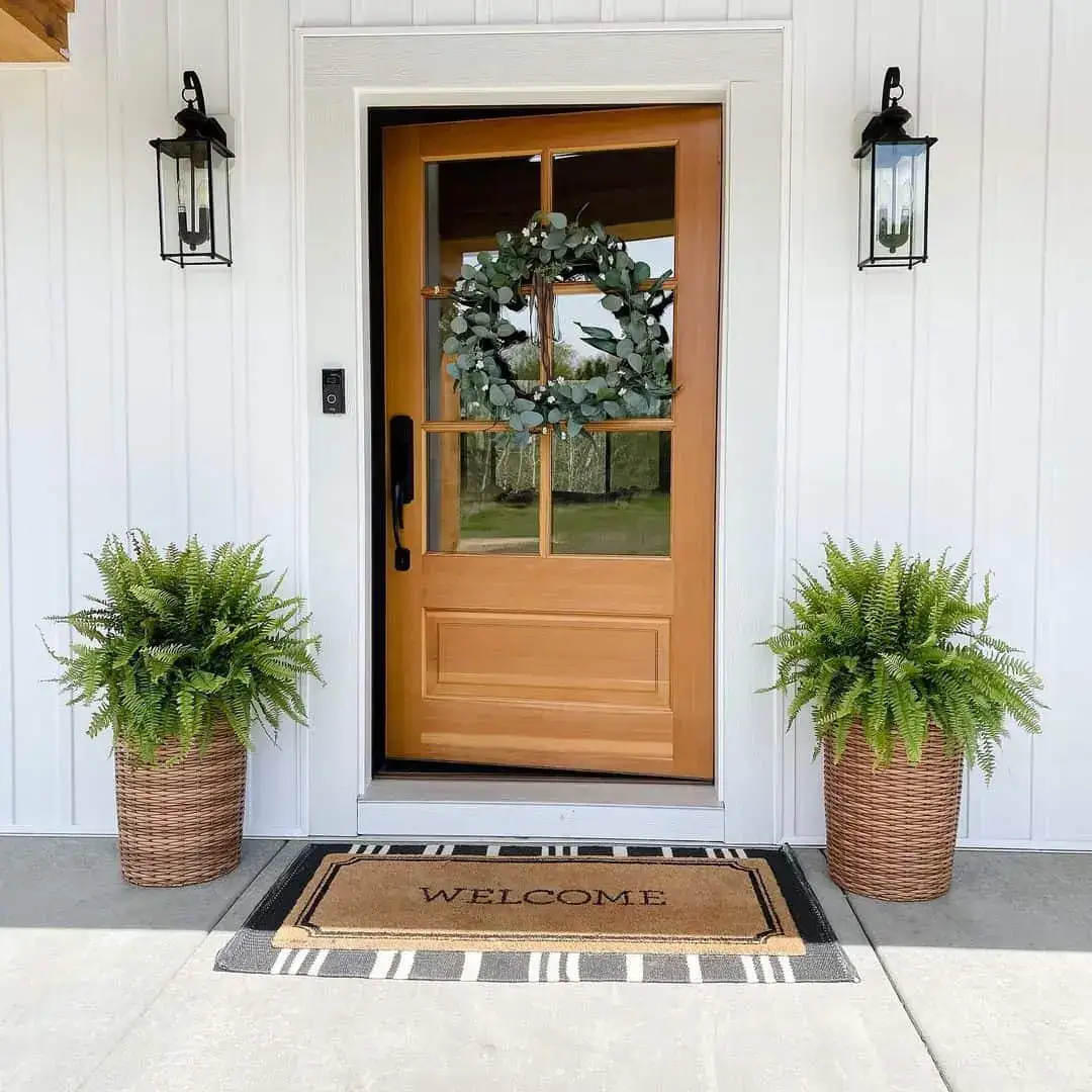 Natural Woven Planters Frame a Warm Wood Door