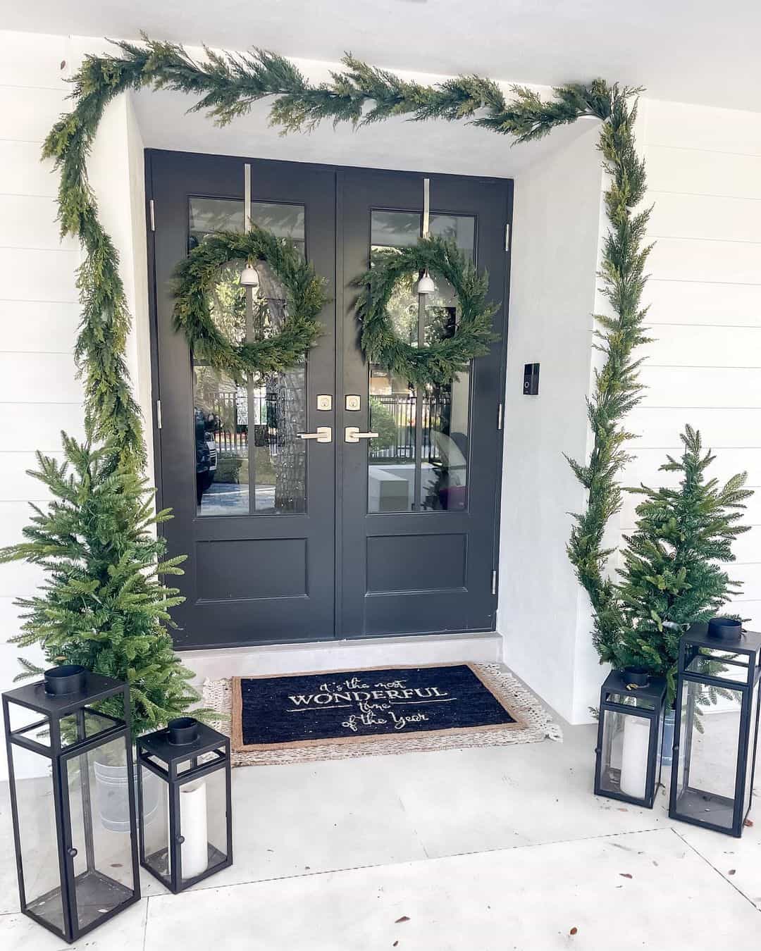 Cascading Greenery and Matching Wreaths Frame Double Doors
