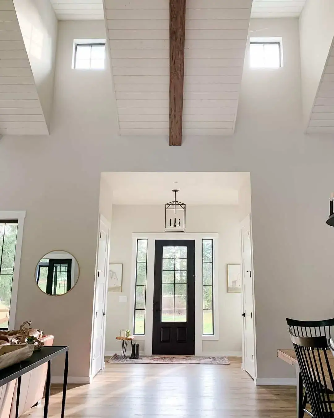 Tall Paned Windows Frame a Dark Farmhouse Door