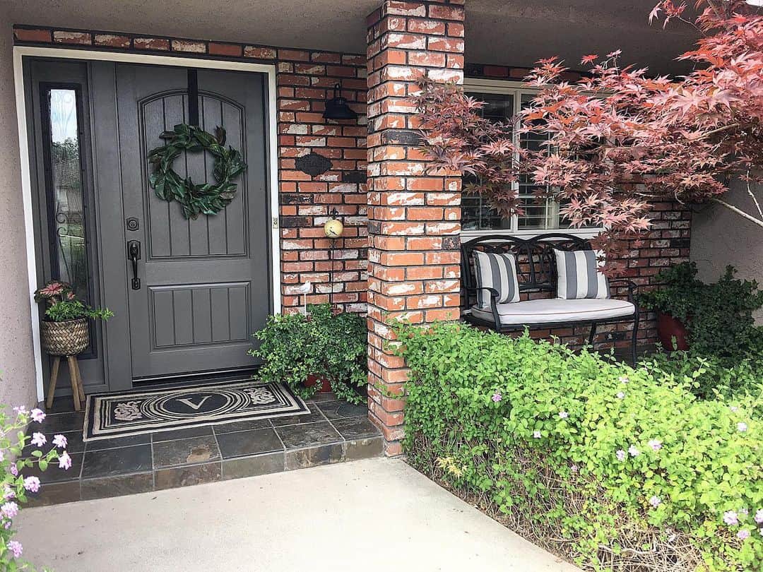 Dark Gray Door Accented with a Single Leafy Wreath