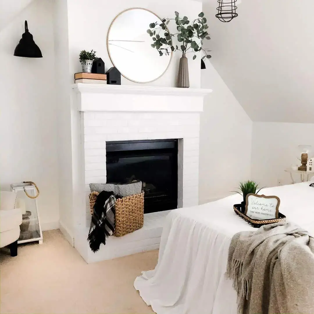 White Brick Fireplace with Woven Basket Storing Cozy Throws